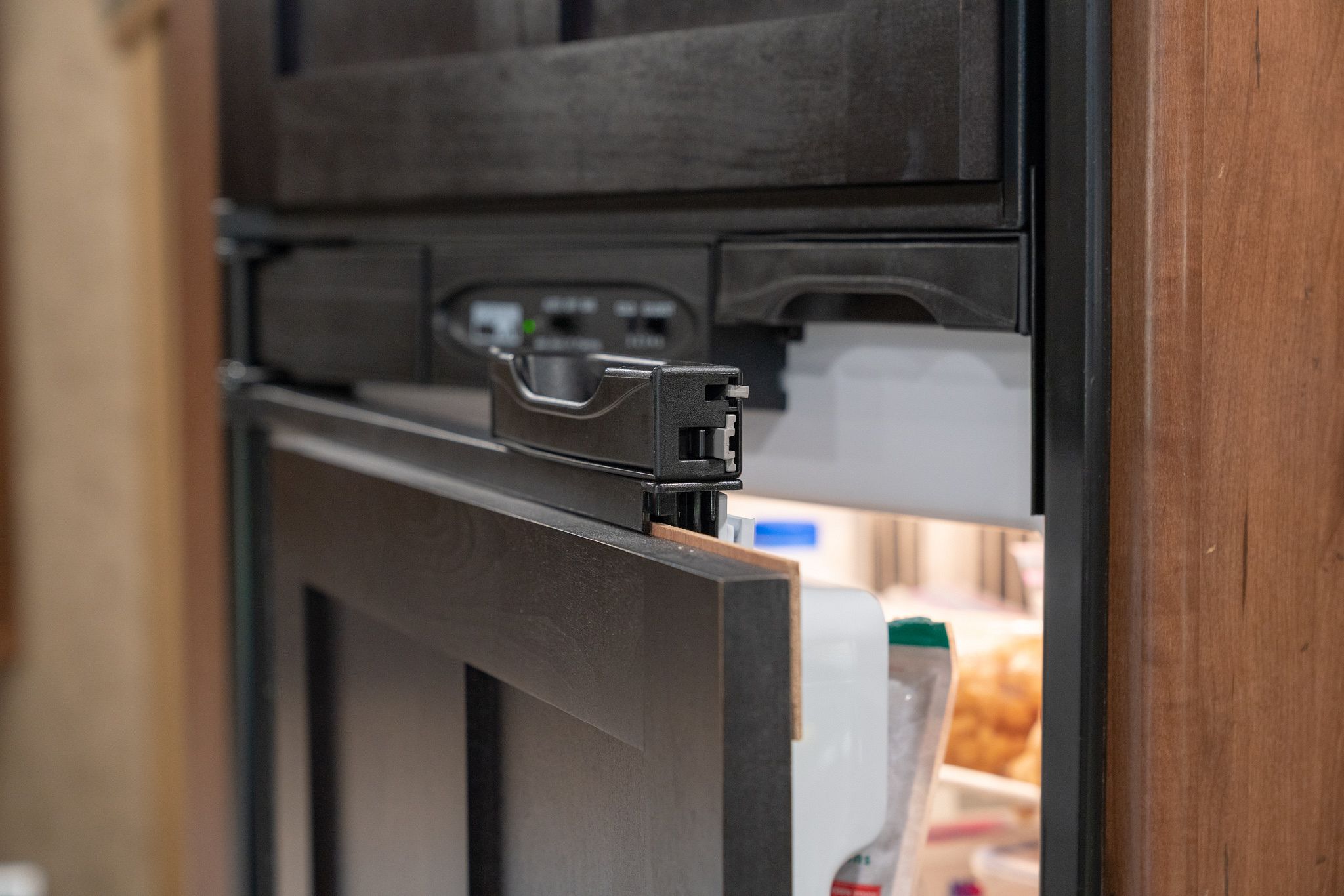 https://www.adventurousway.com/images/i/8t7bx7w05779/2048w/mods/installing-magnetic-dry-erase-rv-fridge-freezer-doors/sliding-out-fridge-door.jpeg